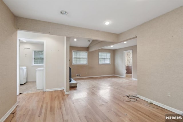 spare room with recessed lighting, visible vents, light wood-type flooring, and baseboards