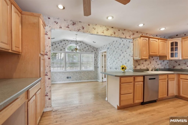 kitchen featuring light brown cabinetry, wallpapered walls, lofted ceiling, dishwasher, and ceiling fan