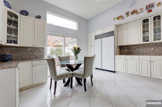 dining area with light tile patterned floors