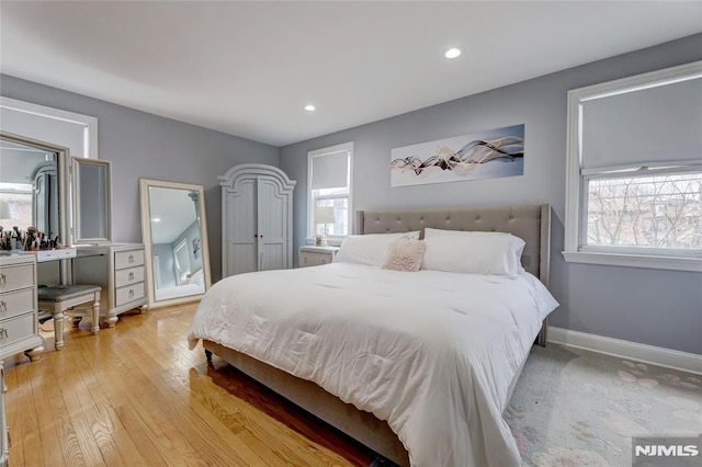 bedroom featuring recessed lighting, light wood-style flooring, and baseboards