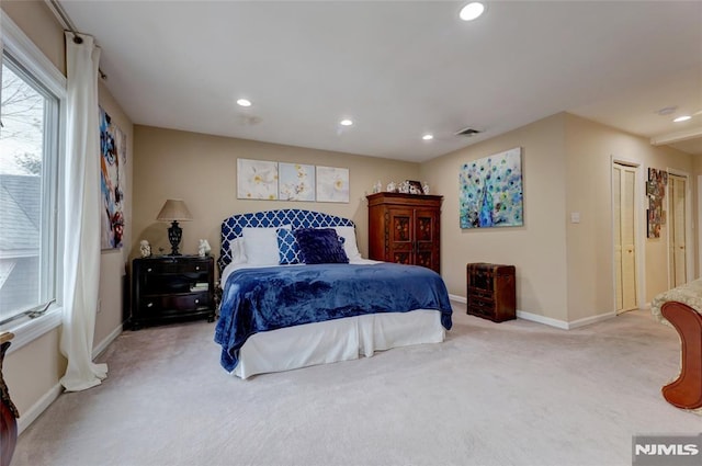 bedroom featuring light carpet, baseboards, visible vents, and recessed lighting