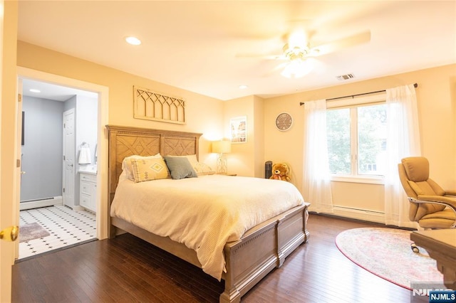 bedroom featuring visible vents, dark wood-type flooring, and baseboard heating