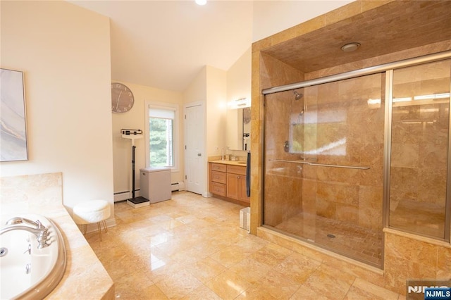 bathroom featuring a garden tub, a stall shower, baseboard heating, vanity, and vaulted ceiling