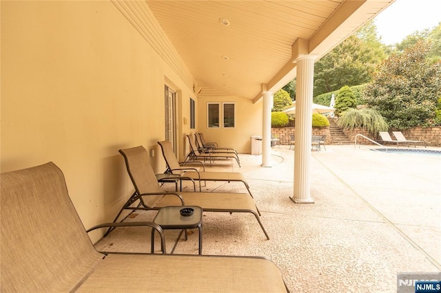 view of patio / terrace featuring a fenced in pool