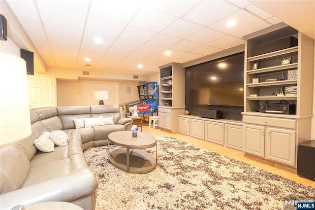 living room with light tile patterned floors, built in features, recessed lighting, and visible vents