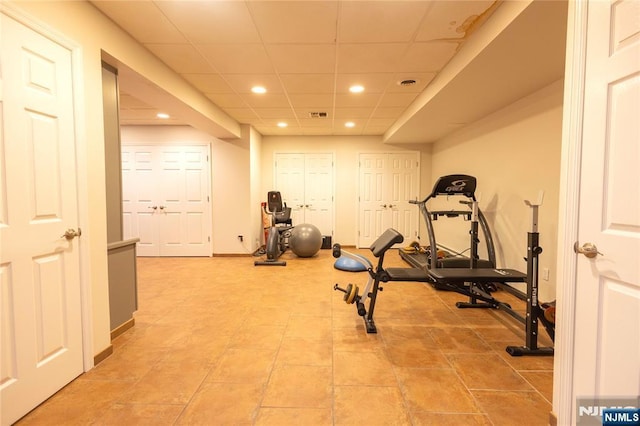 workout room with visible vents, recessed lighting, and a paneled ceiling