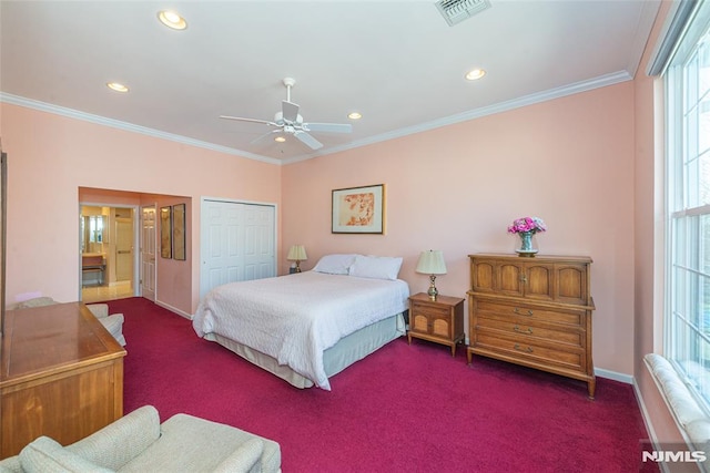 bedroom featuring a closet, visible vents, crown molding, and carpet floors