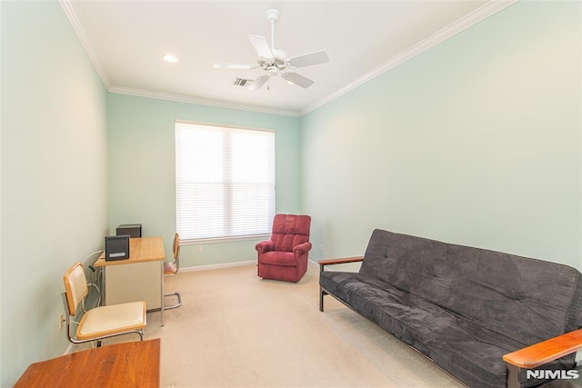 living area with crown molding, a ceiling fan, baseboards, and carpet floors