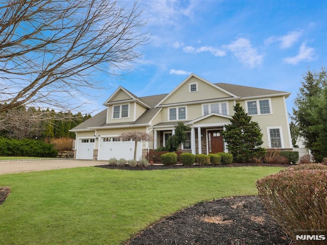 view of front of property with driveway and a front lawn