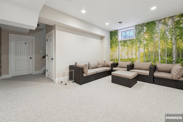 carpeted living area with baseboards and recessed lighting