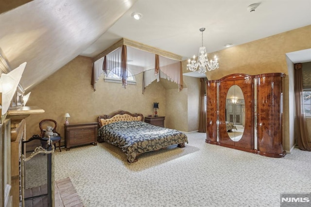 carpeted bedroom featuring lofted ceiling and a chandelier