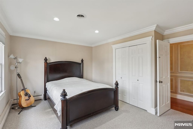 bedroom with a baseboard radiator, a closet, visible vents, and crown molding