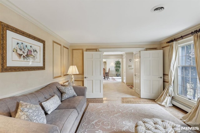 living room featuring visible vents, crown molding, and baseboard heating