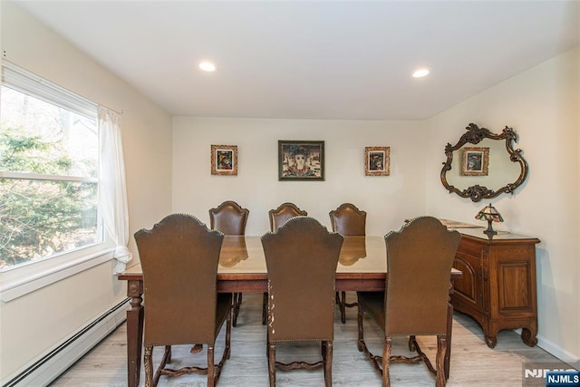 dining area featuring light wood finished floors, baseboard heating, recessed lighting, and a healthy amount of sunlight