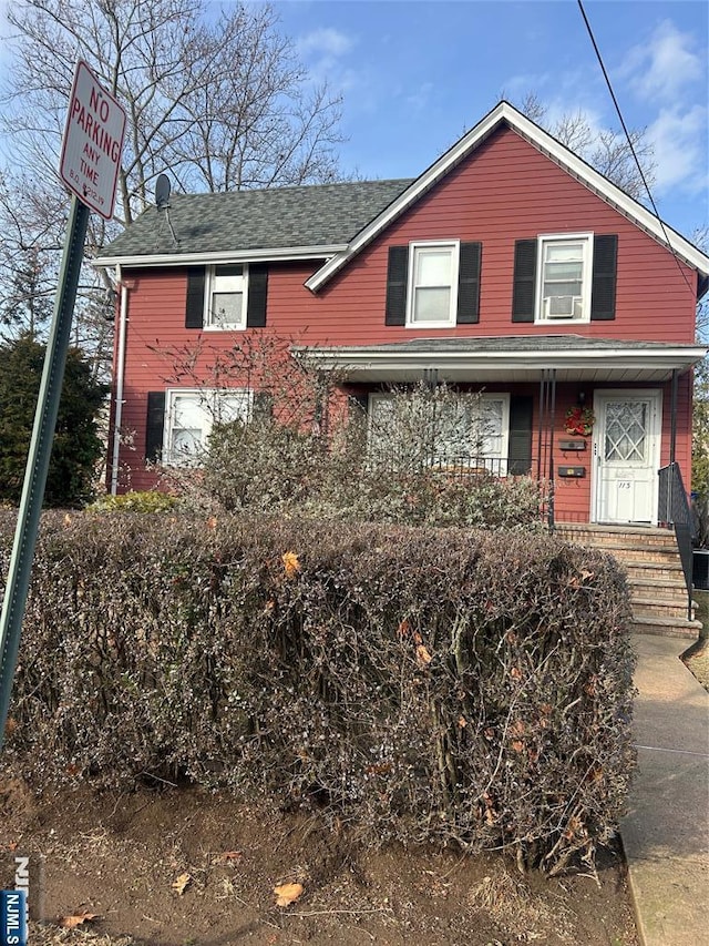 traditional-style house featuring a porch