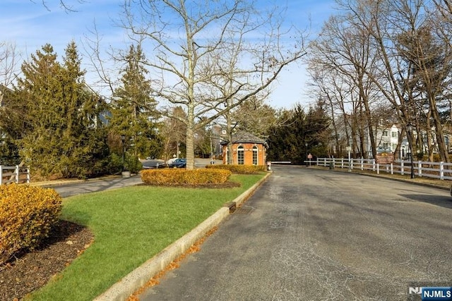 view of road featuring curbs