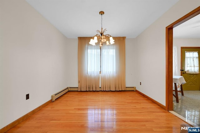 unfurnished room featuring a chandelier, a baseboard radiator, baseboards, and light wood finished floors