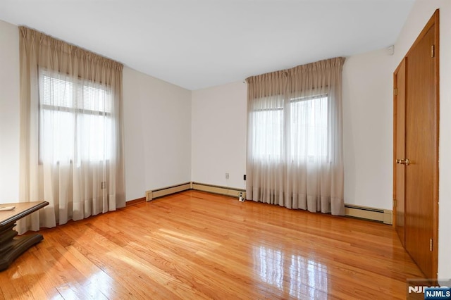 empty room with light wood finished floors