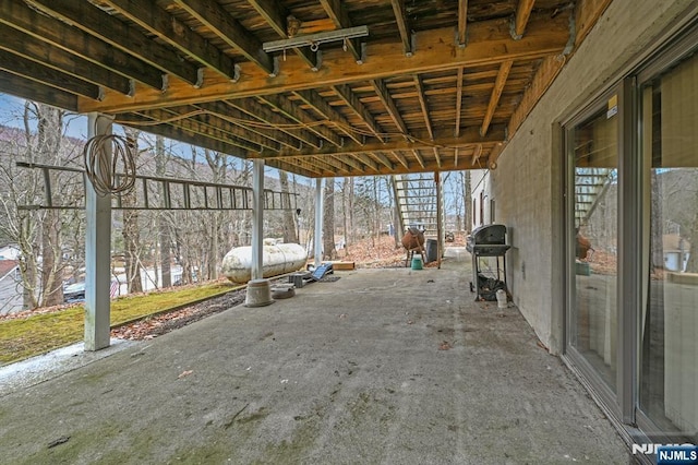 view of patio featuring a grill