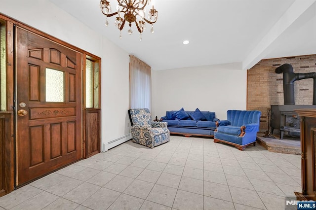 entrance foyer with light tile patterned floors, a chandelier, a wood stove, a baseboard heating unit, and recessed lighting