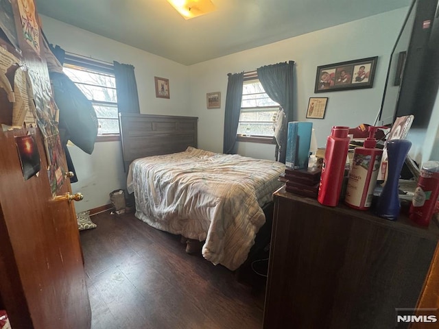 bedroom with wood finished floors