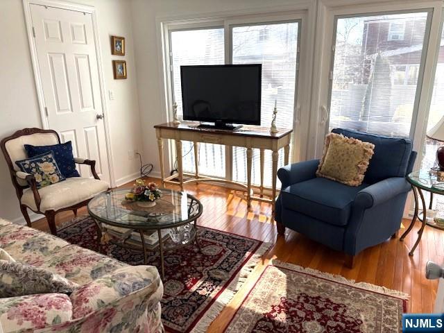 living room featuring baseboards and wood finished floors