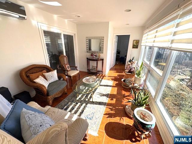 sunroom with a wall unit AC