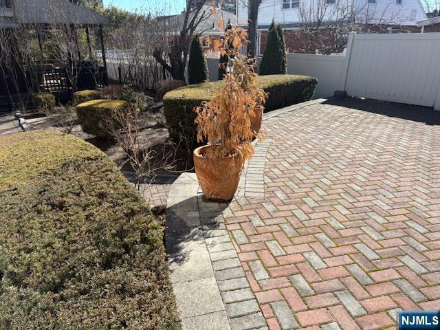 view of patio featuring fence