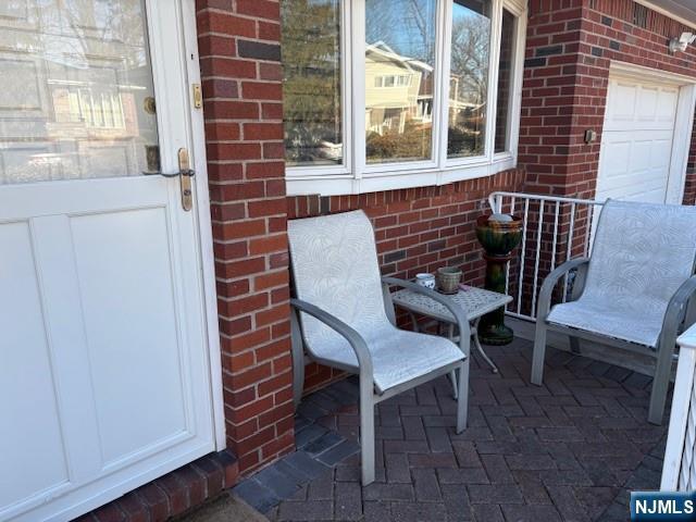 view of patio / terrace featuring an attached garage