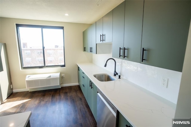 kitchen with baseboards, a sink, dark wood-type flooring, a wall mounted air conditioner, and dishwasher