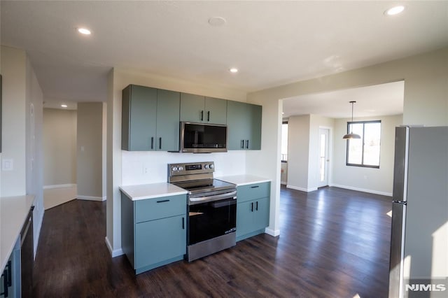 kitchen featuring baseboards, light countertops, recessed lighting, dark wood-style floors, and stainless steel appliances