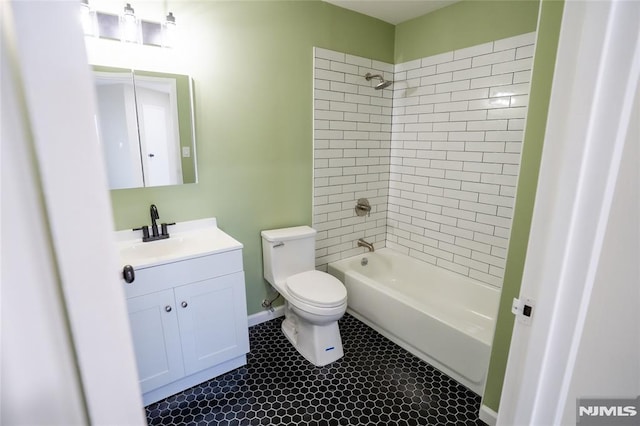 full bathroom featuring shower / bath combination, toilet, vanity, and tile patterned flooring