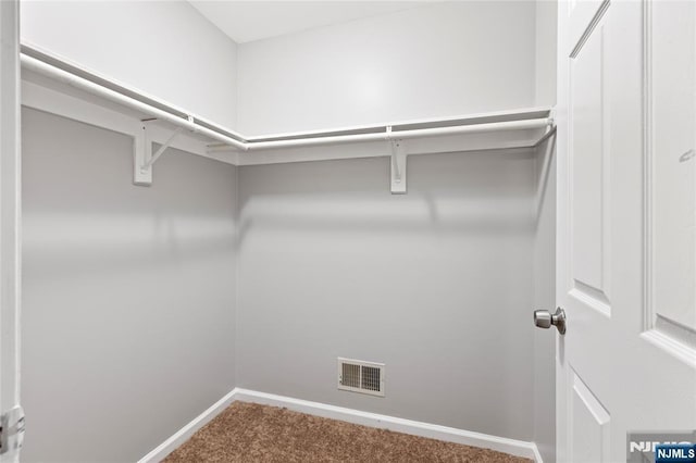 walk in closet with carpet flooring and visible vents