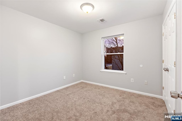 unfurnished bedroom featuring baseboards, visible vents, and carpet flooring