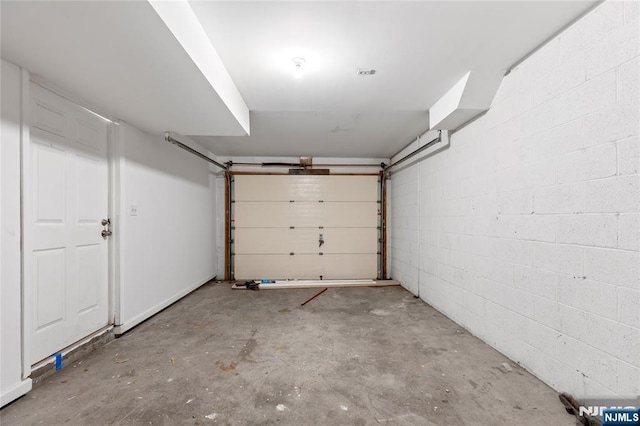 garage with concrete block wall