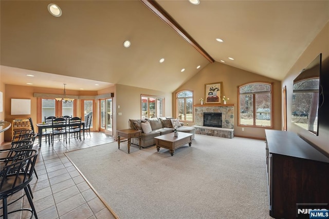 tiled living room featuring high vaulted ceiling, recessed lighting, a fireplace, and carpet floors