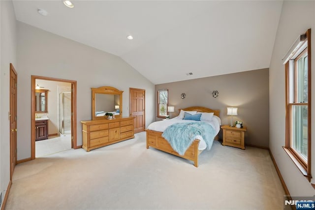 bedroom with lofted ceiling, light colored carpet, baseboards, and multiple windows