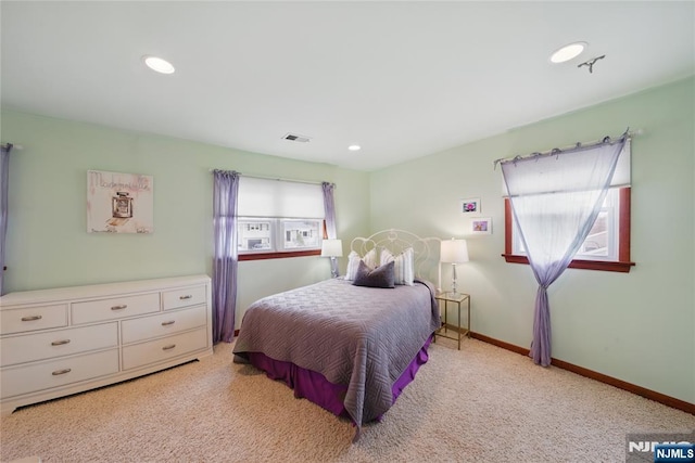 bedroom featuring light carpet, recessed lighting, visible vents, and baseboards