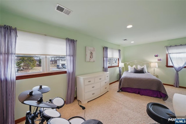 bedroom with recessed lighting, light colored carpet, visible vents, and baseboards