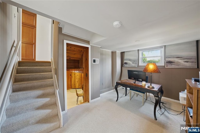 carpeted office space featuring visible vents and baseboards