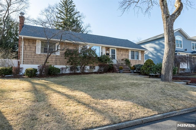 single story home featuring roof with shingles, a chimney, a front yard, and fence