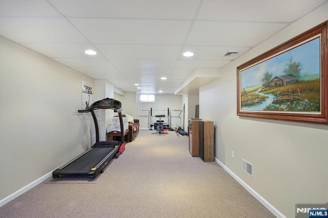 exercise area featuring carpet, visible vents, and baseboards