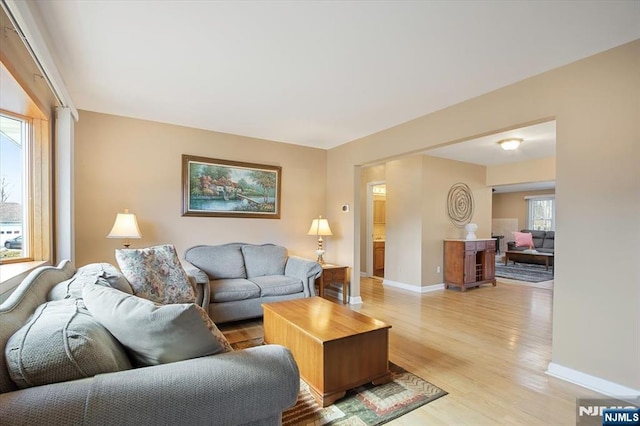 living room with light wood-style floors and baseboards