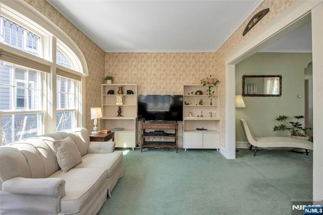 living area with carpet, baseboards, wallpapered walls, arched walkways, and ornamental molding