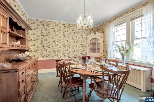 dining space featuring wallpapered walls, crown molding, carpet flooring, and baseboards