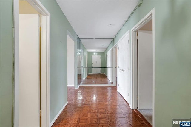 hallway featuring baseboards