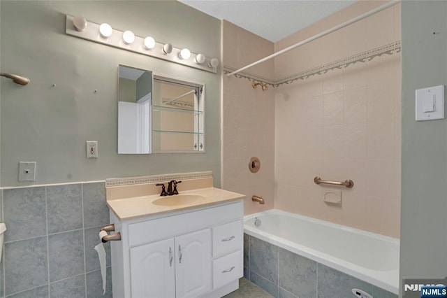 bathroom featuring vanity and shower / washtub combination