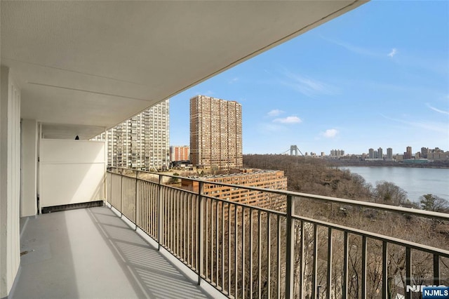 balcony with a view of city and a water view