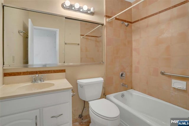 bathroom featuring shower / bathtub combination, toilet, and vanity