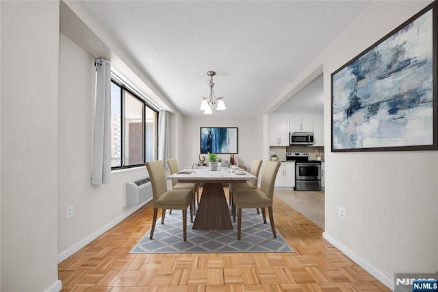 dining space featuring a wall mounted air conditioner, baseboards, and a chandelier